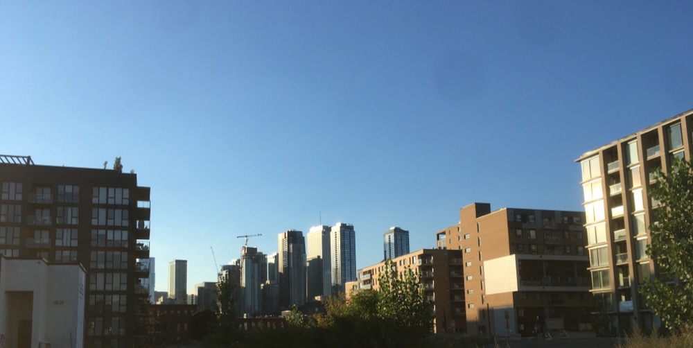 A crane punctures the skyline of downtown Montreal